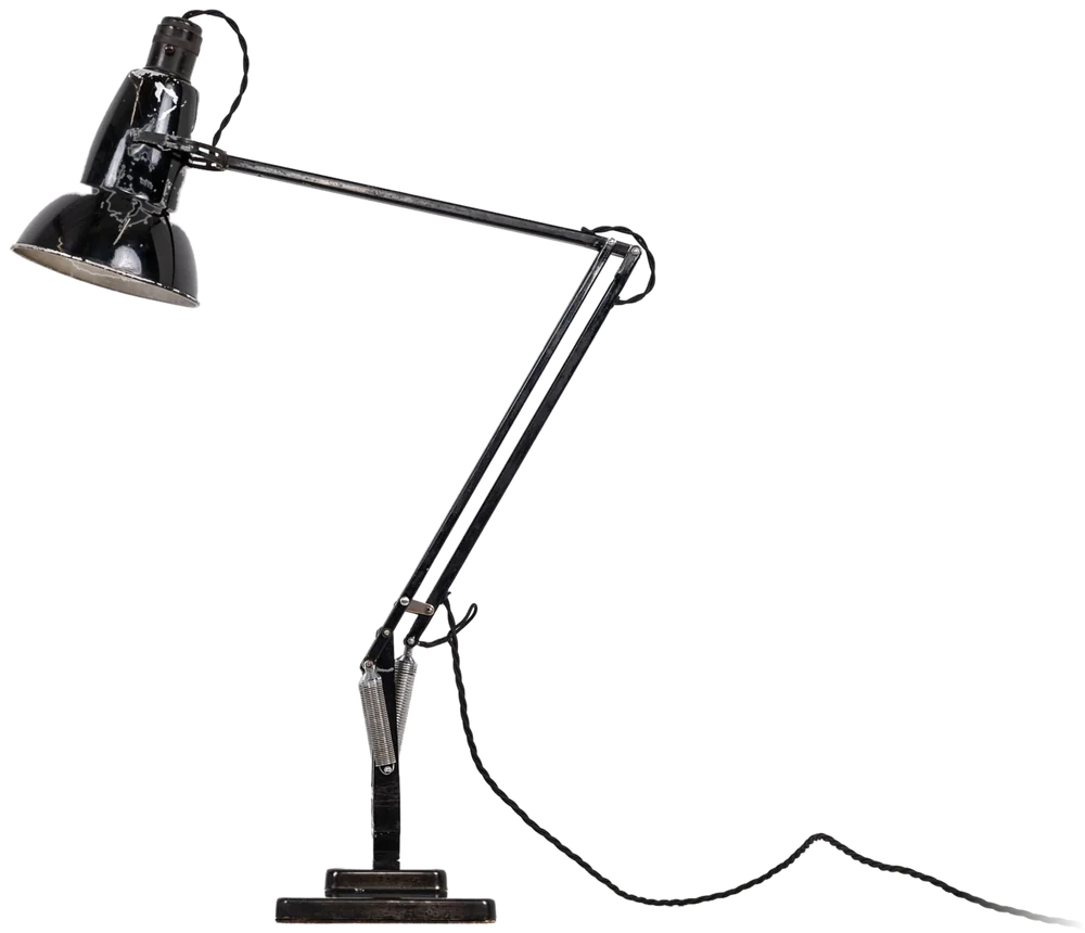 A vintage black anglepoise desk lamp angled towards the headline