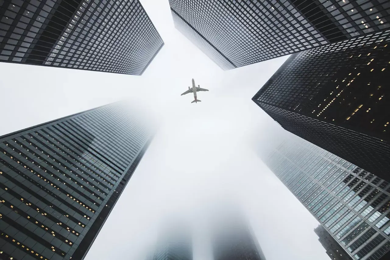 Plane over city